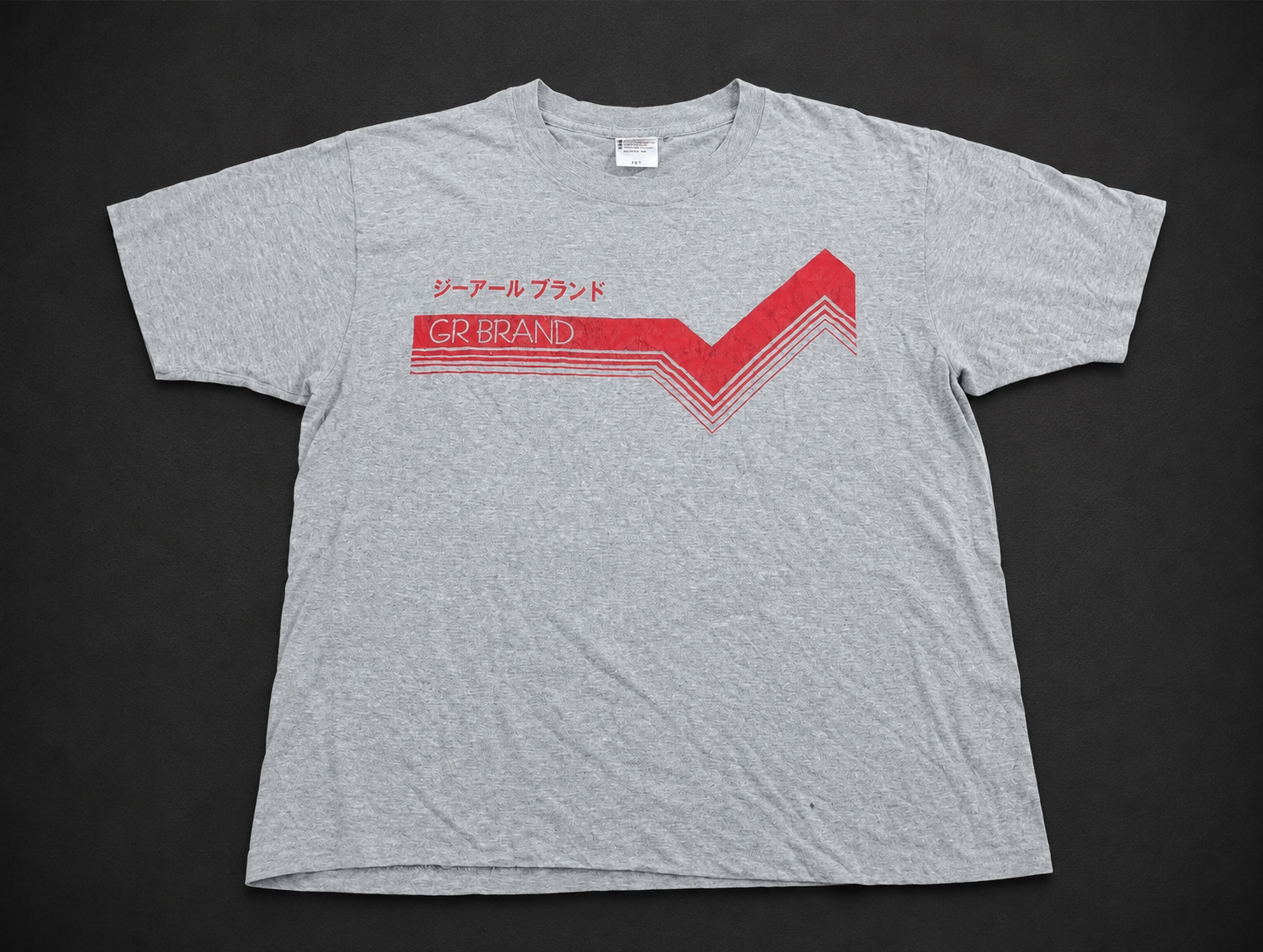 Grey Japanese Arrow Graphic Tee from Quality Thrift, one-of-one pre-loved apparel listing