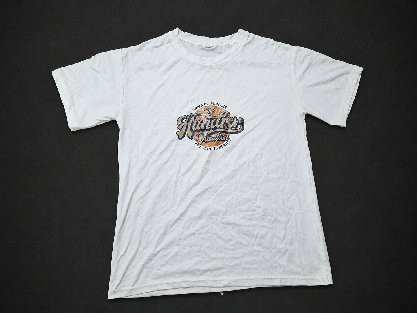 White Script Chest Graphic Tee, one-of-one pre-loved apparel from Quality Thrift